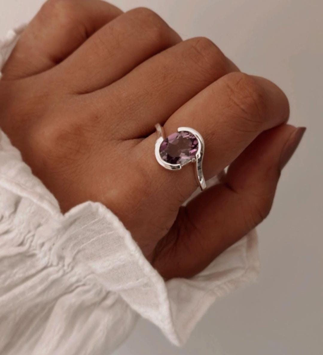 Amethyst Oval Faceted Stone Set in Cross Band Silver Ring