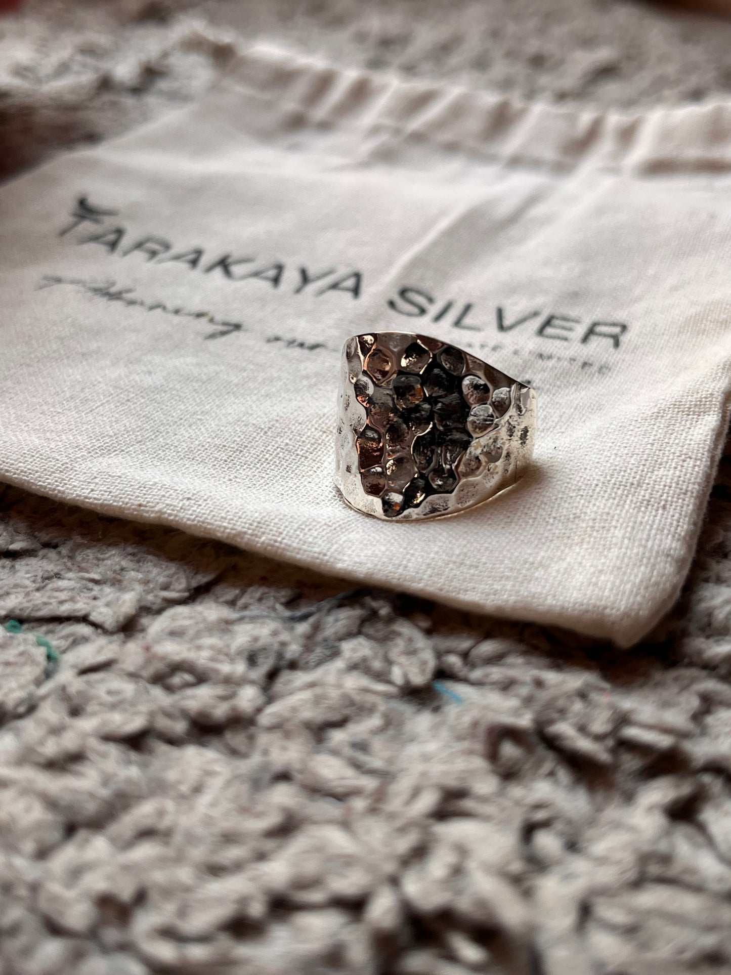 Sleek chunky silver ring with hammered texture