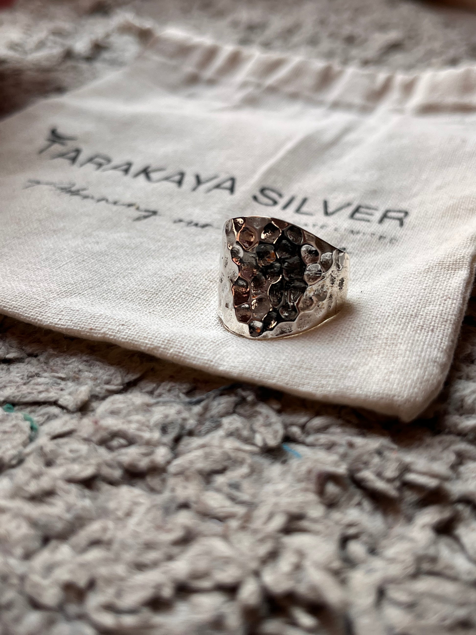 Sleek chunky silver ring with hammered texture