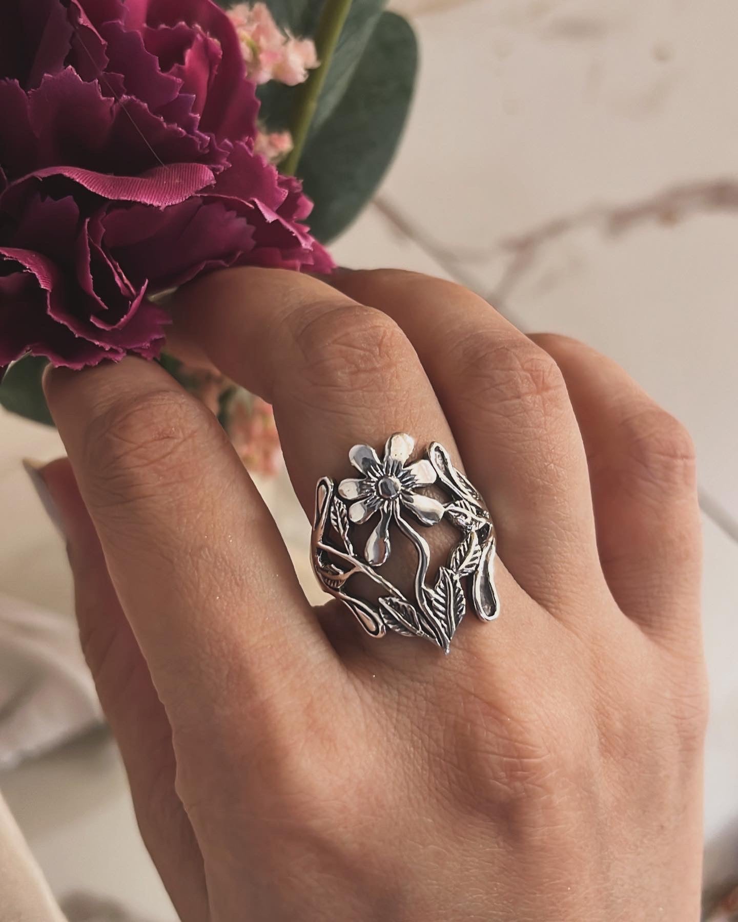 Statement big floral garden ring in sterling silver with a chunky design.