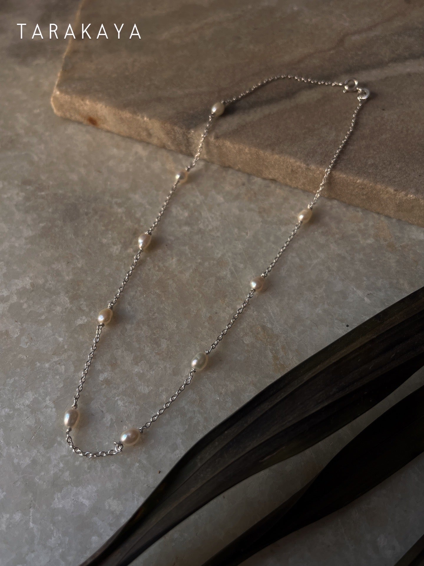 Elegant sterling silver choker with serene freshwater pearls on cable chain