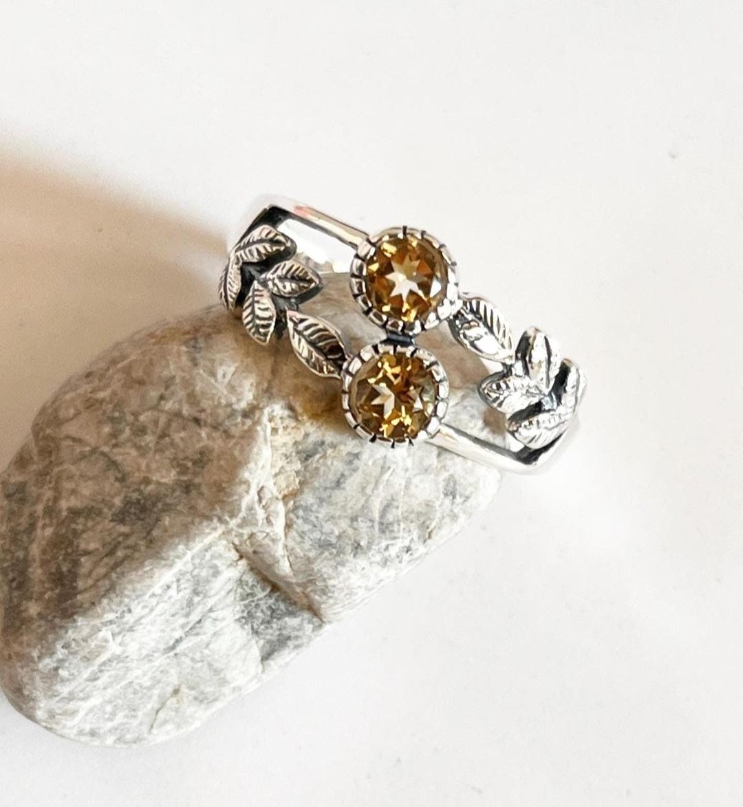 Handcrafted silver ring featuring a citrine stone in a forest enchantment design