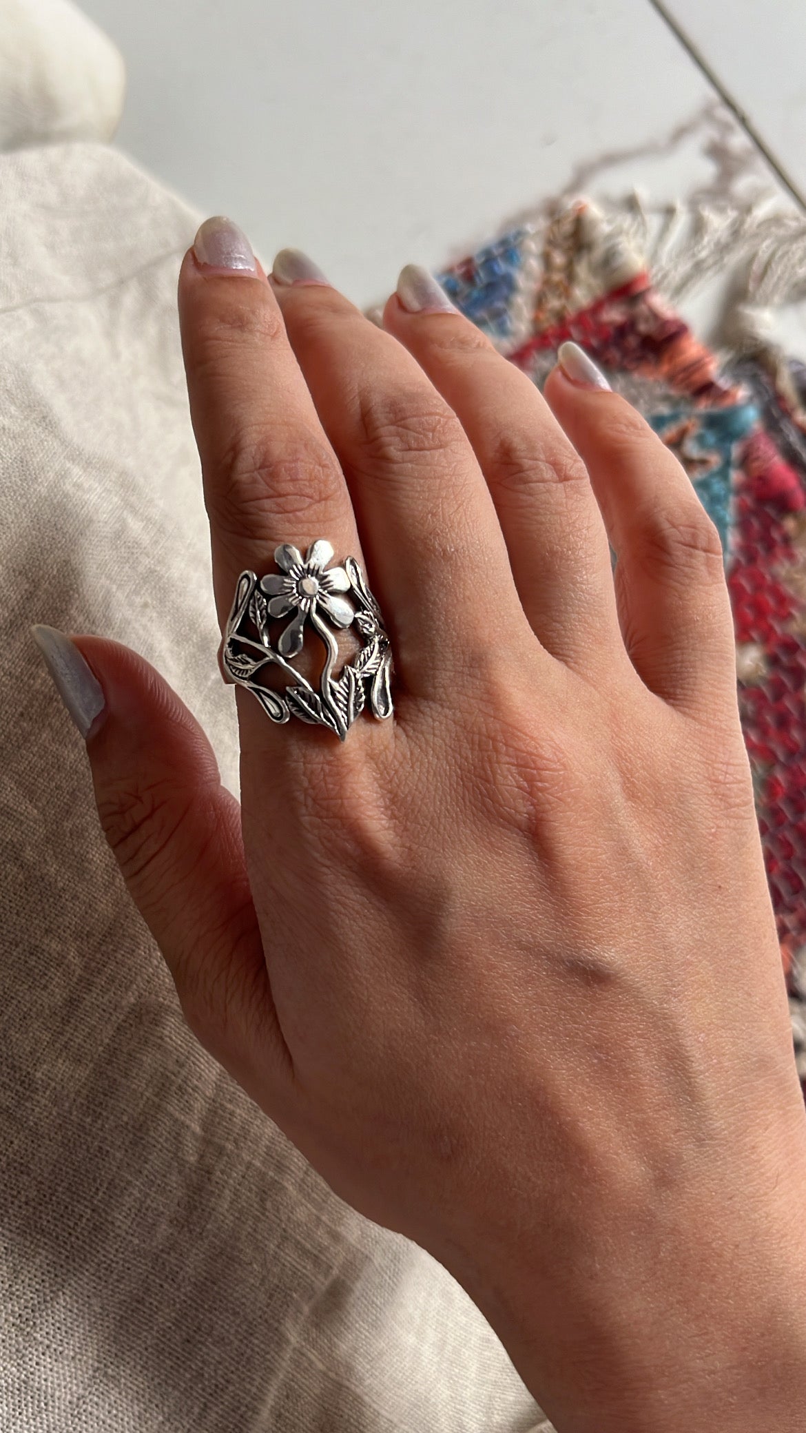 Handcrafted chunky silver ring with a beautiful floral garden pattern.