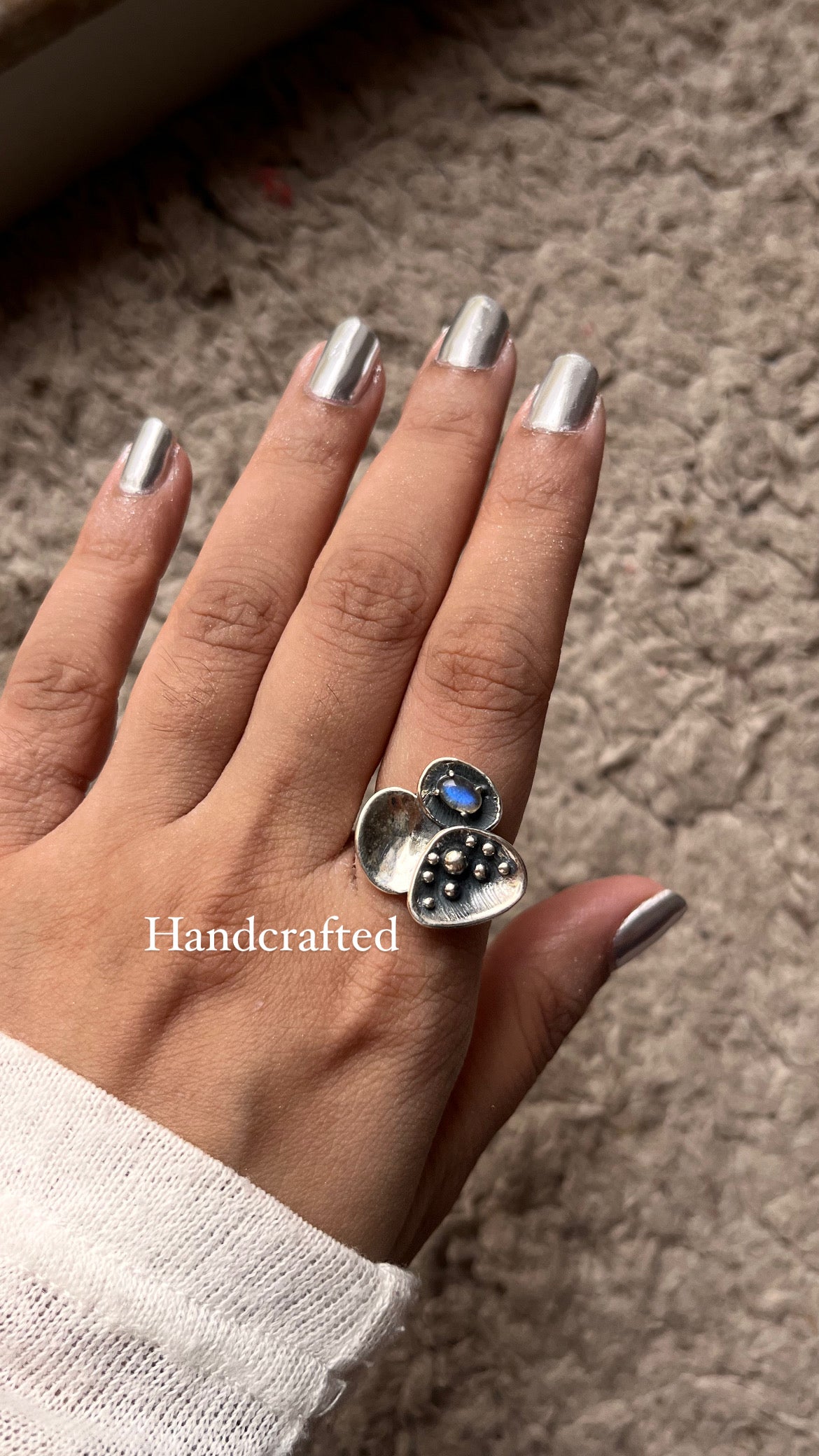 Elegant Divine Lotus silver ring featuring a luminous moonstone