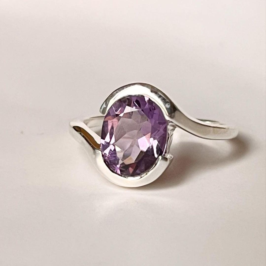 Silver Ring with Oval-Cut Amethyst and Intricate Cross Band
