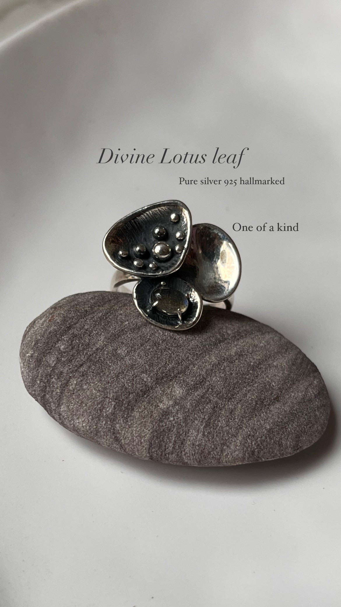 Divine Lotus-inspired silver ring with glowing moonstone accent