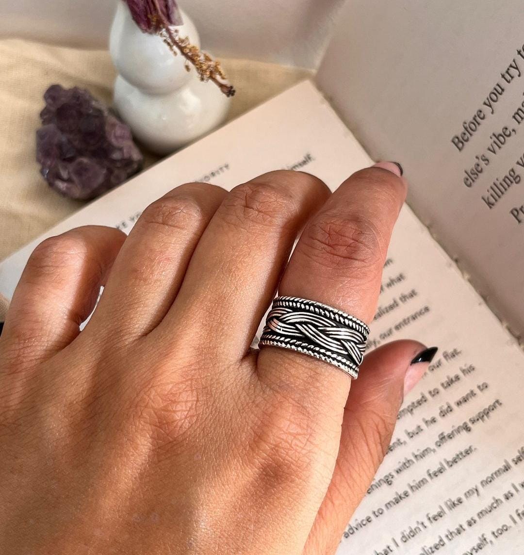 Elegant braided band silver ring with tribal design