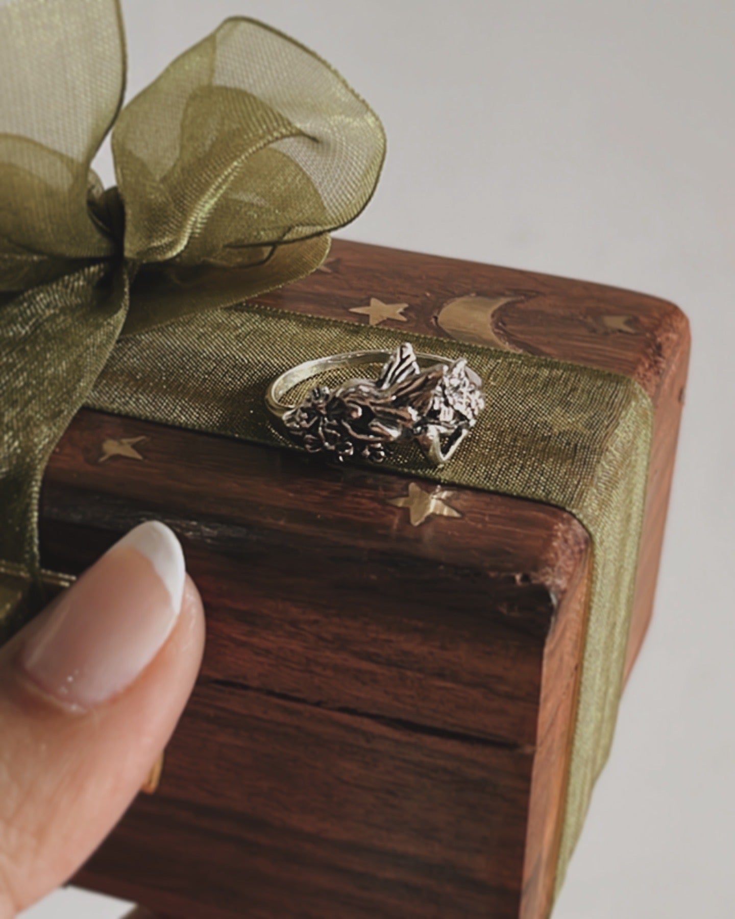 Close-up of fairy in the garden silver ring with magical garden motif