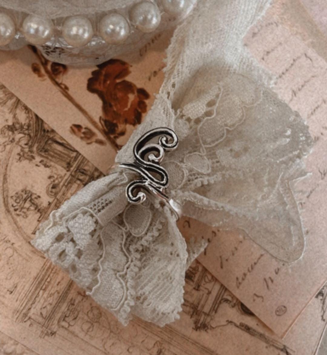 Antique-style silver ring with spiral motif