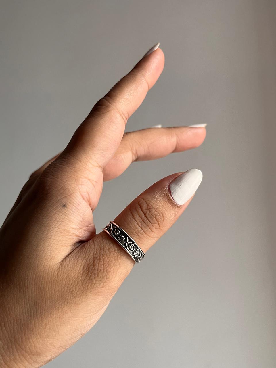 Charming floral engraved band silver ring featuring delicate flower motifs