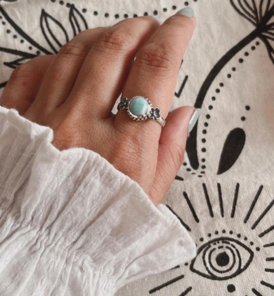 Close-up of cherry blossom silver ring with Larimar gemstone