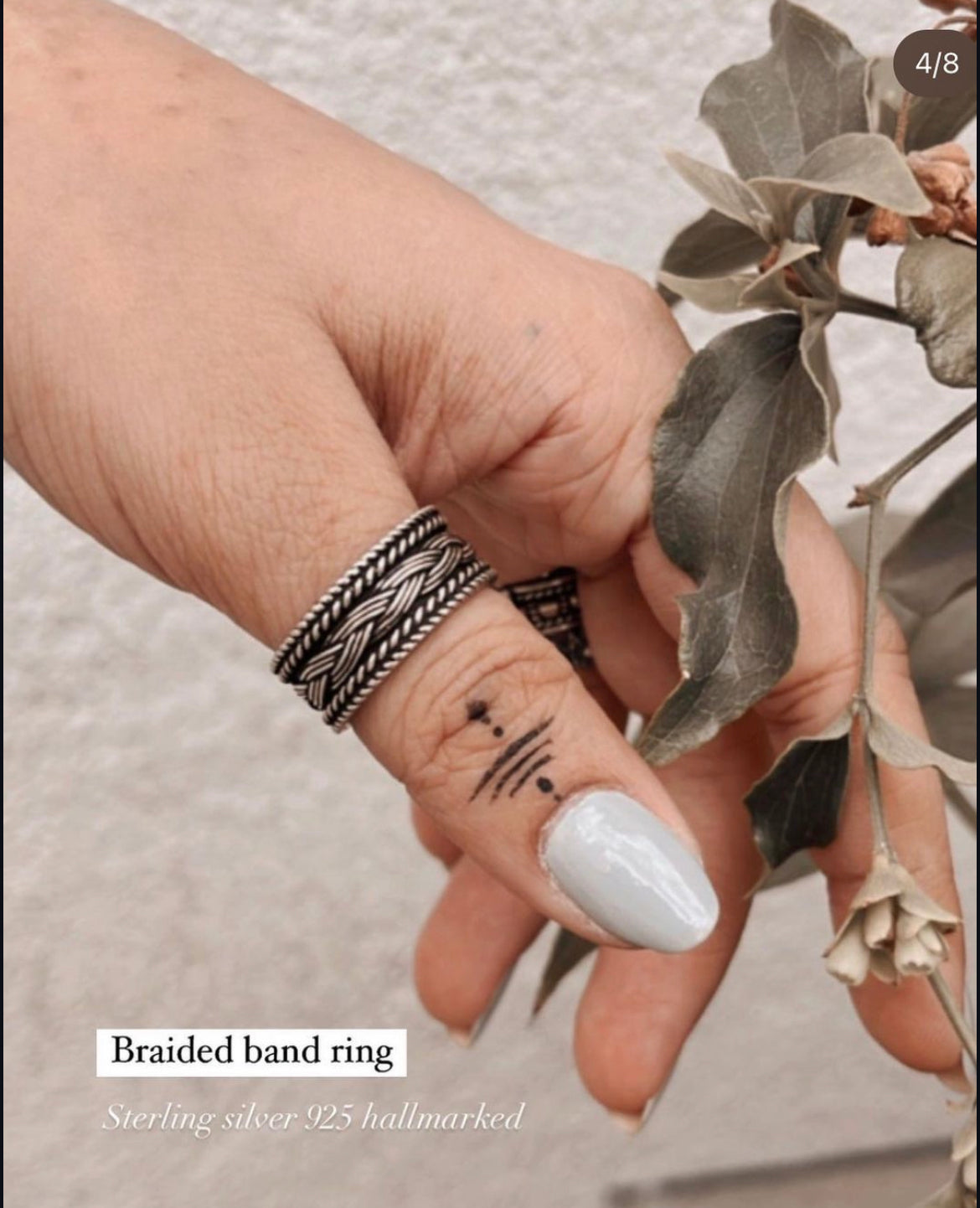 Elegant braided band silver ring with tribal design