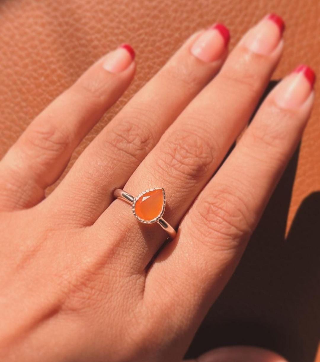Carnelian pear silver ring with a polished silver band