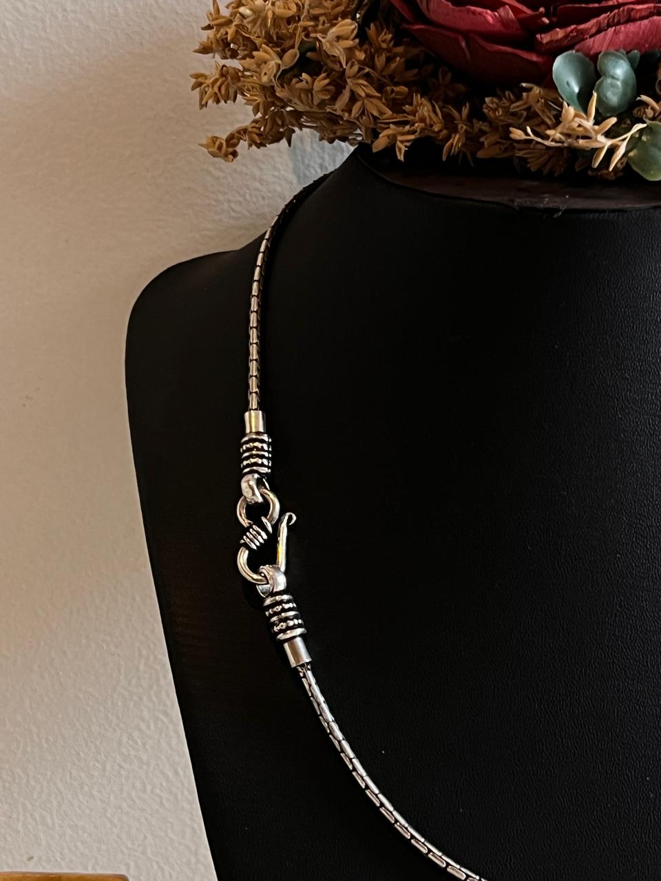 Timeless sterling silver chain with a detailed antique S-lock clasp.
