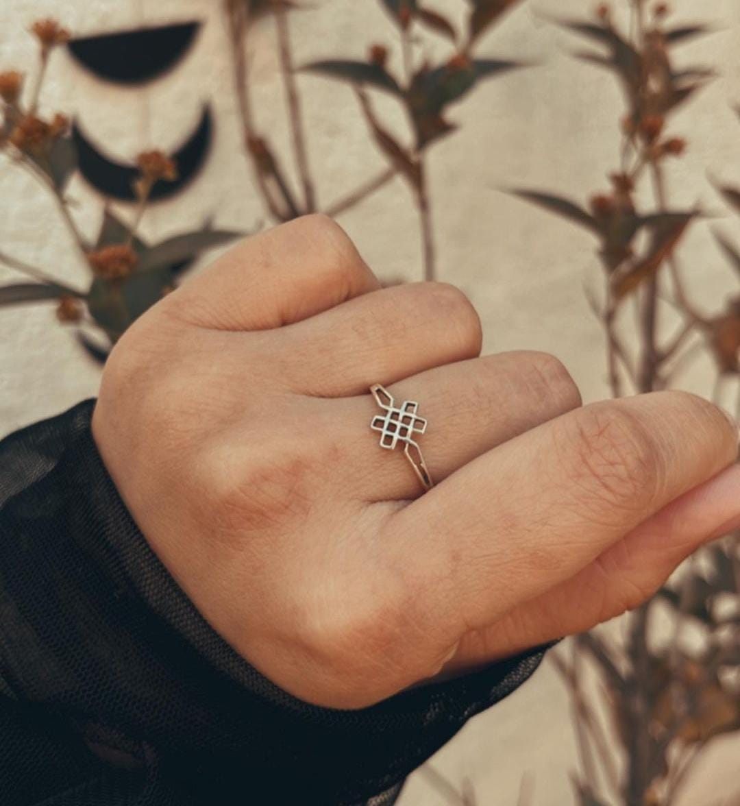 Sterling Silver Celtic Knot Ring with Karma Symbol