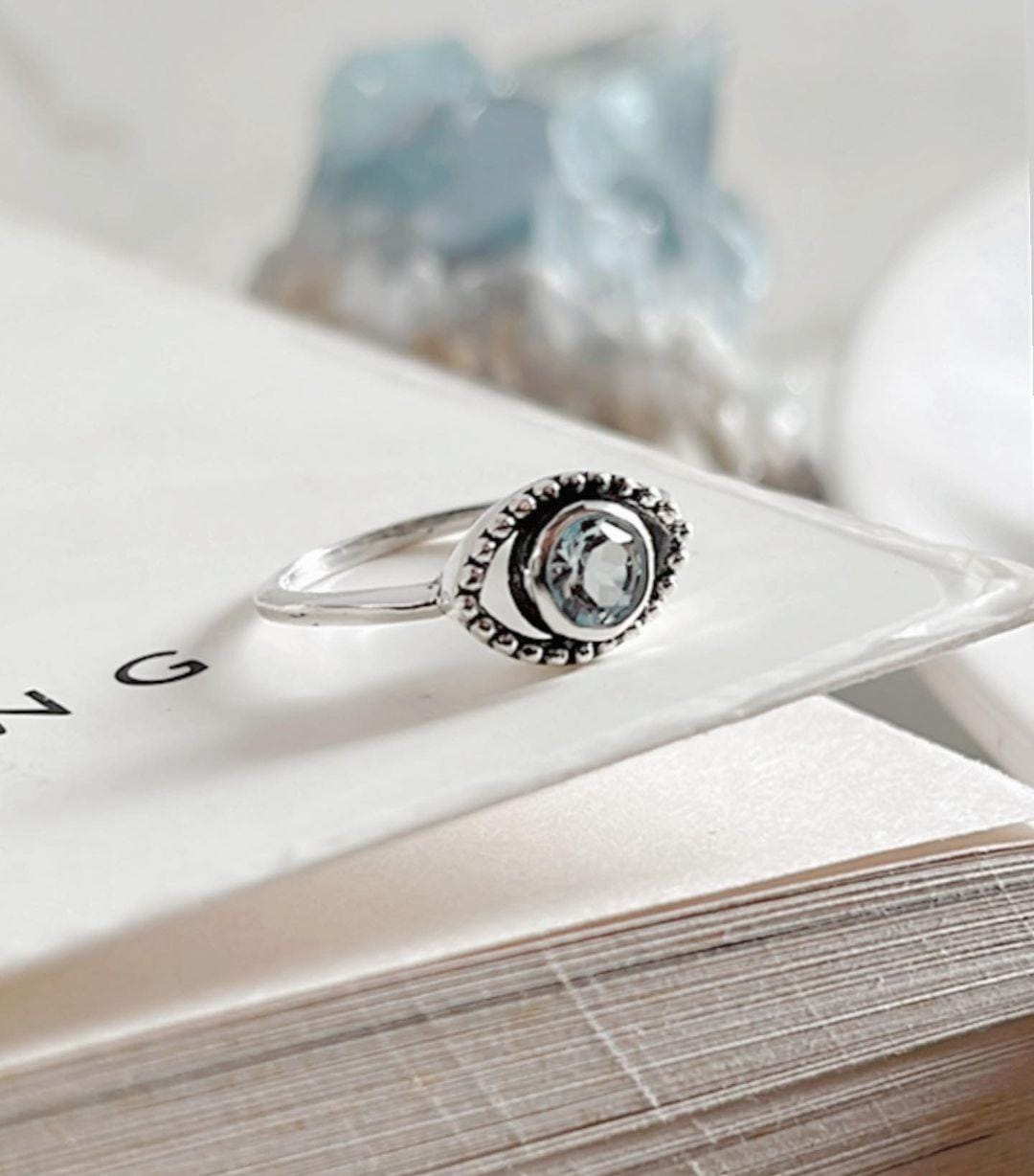 Handcrafted evil eye silver ring with blue topaz for spiritual protection
