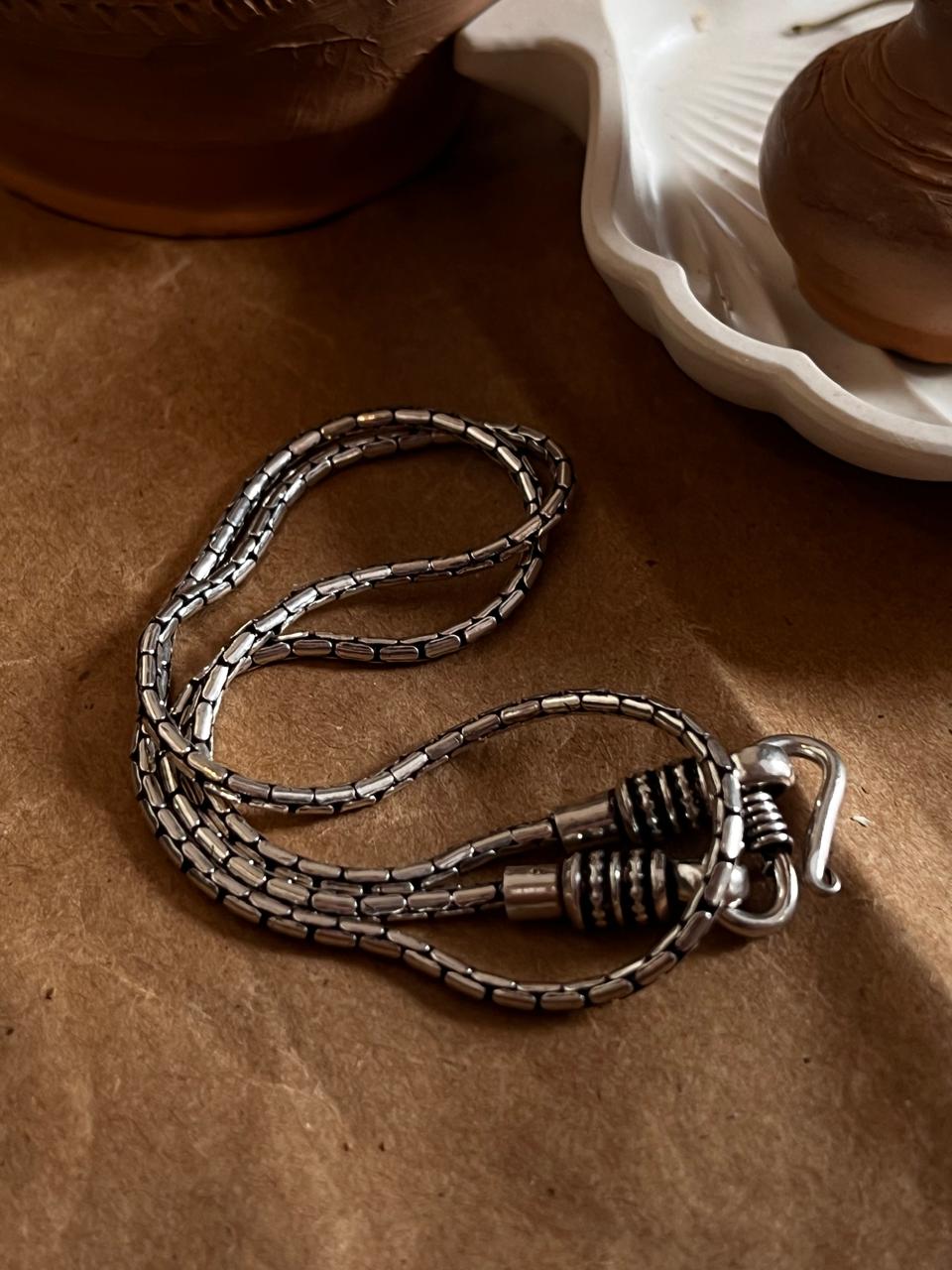 Sterling silver chain featuring a unique antique S-lock clasp.