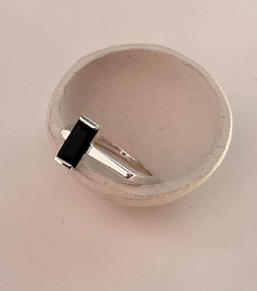 Chic Silver Ring Featuring Black Onyx and Side Stones