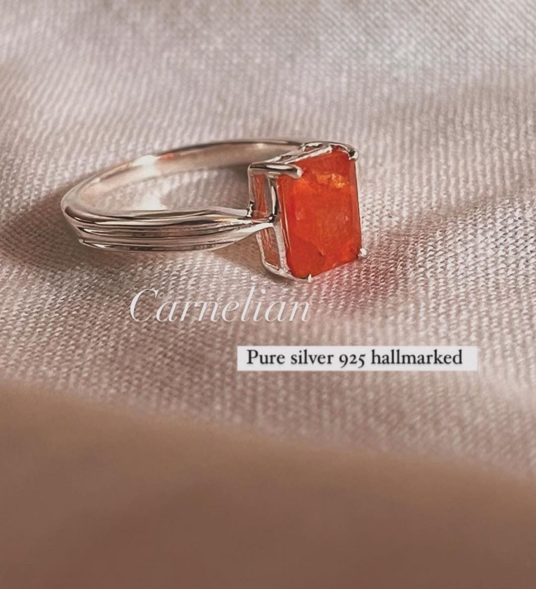Elegant silver ring featuring a rectangular carnelian stone