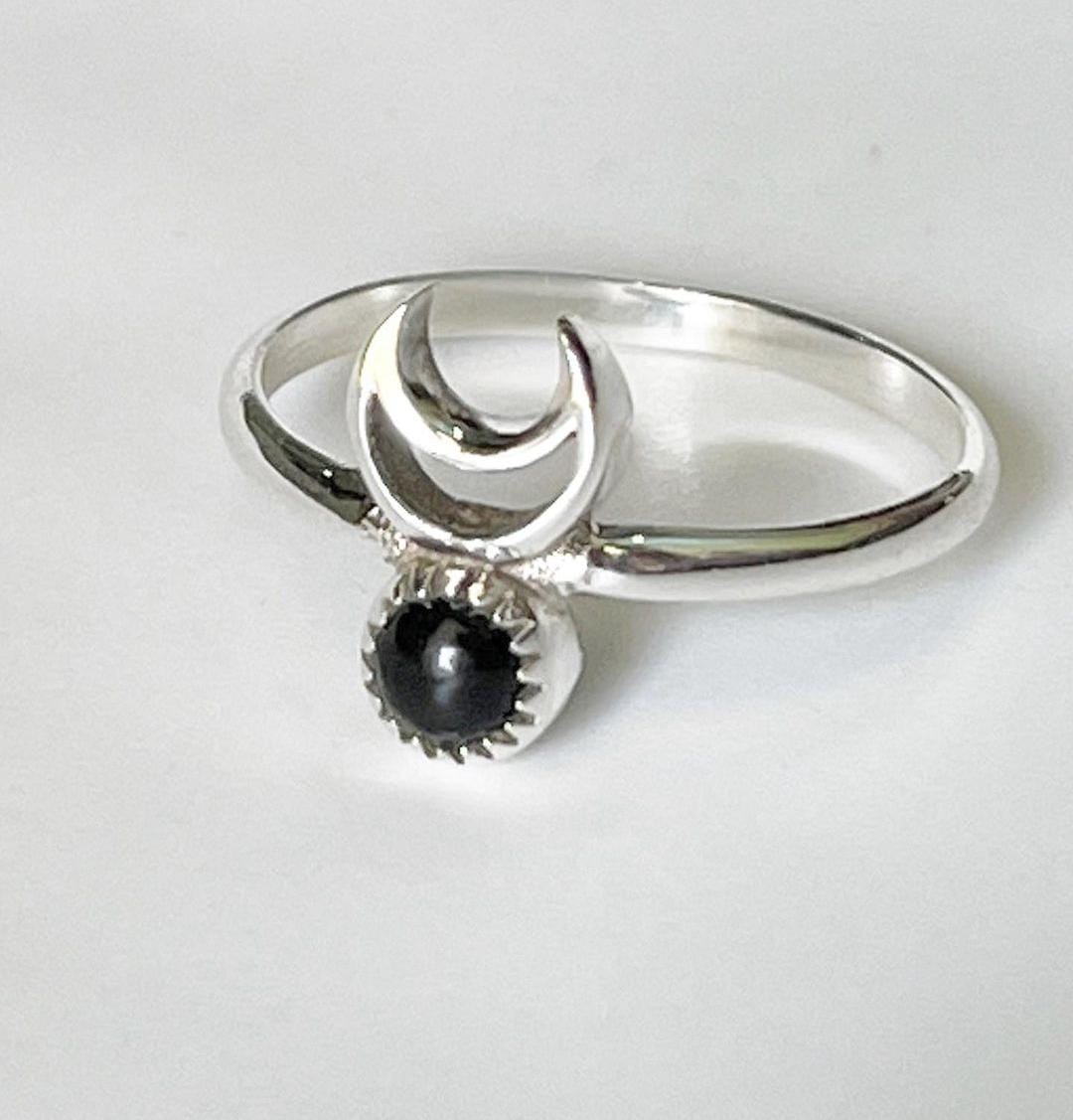 Sleek black onyx crescent moon silver ring for a modern, celestial look.