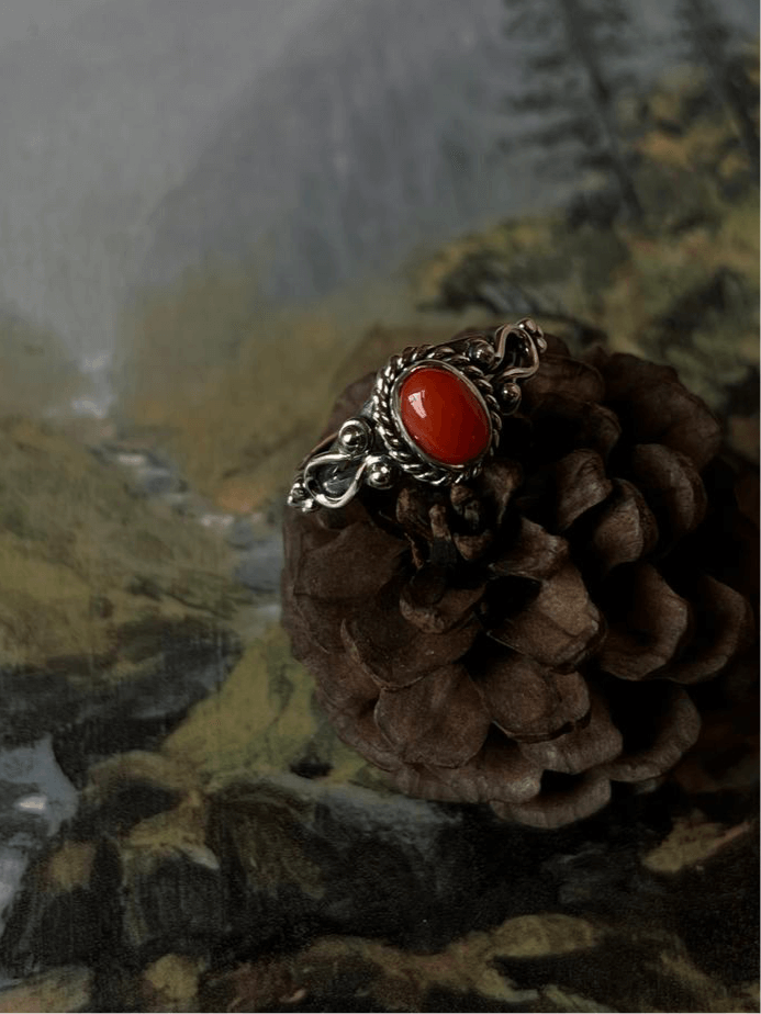 Vibrant Coral Gemstone set in oval silver band for bohemian style