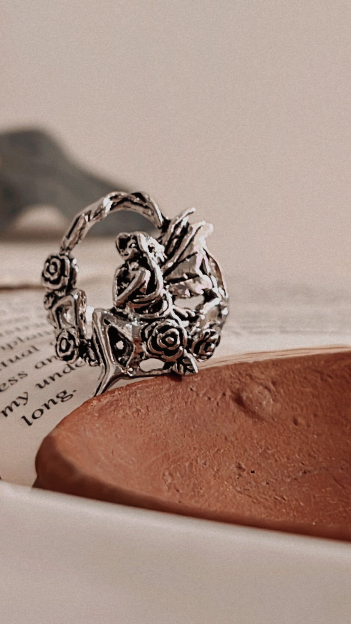 Close-up of fairy in forest silver ring with detailed forest elements