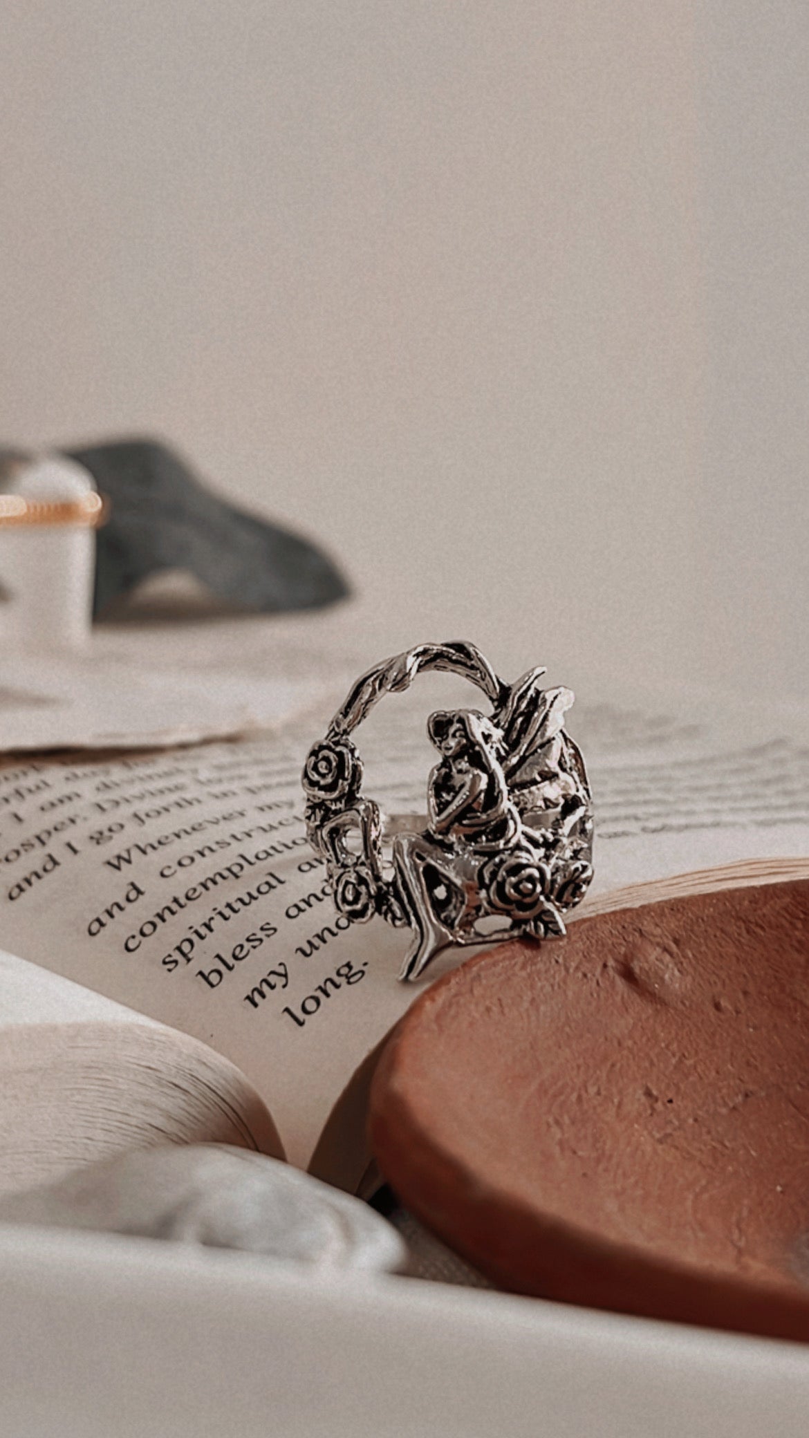 Elegant fairy in forest silver ring capturing a mystical woodland theme