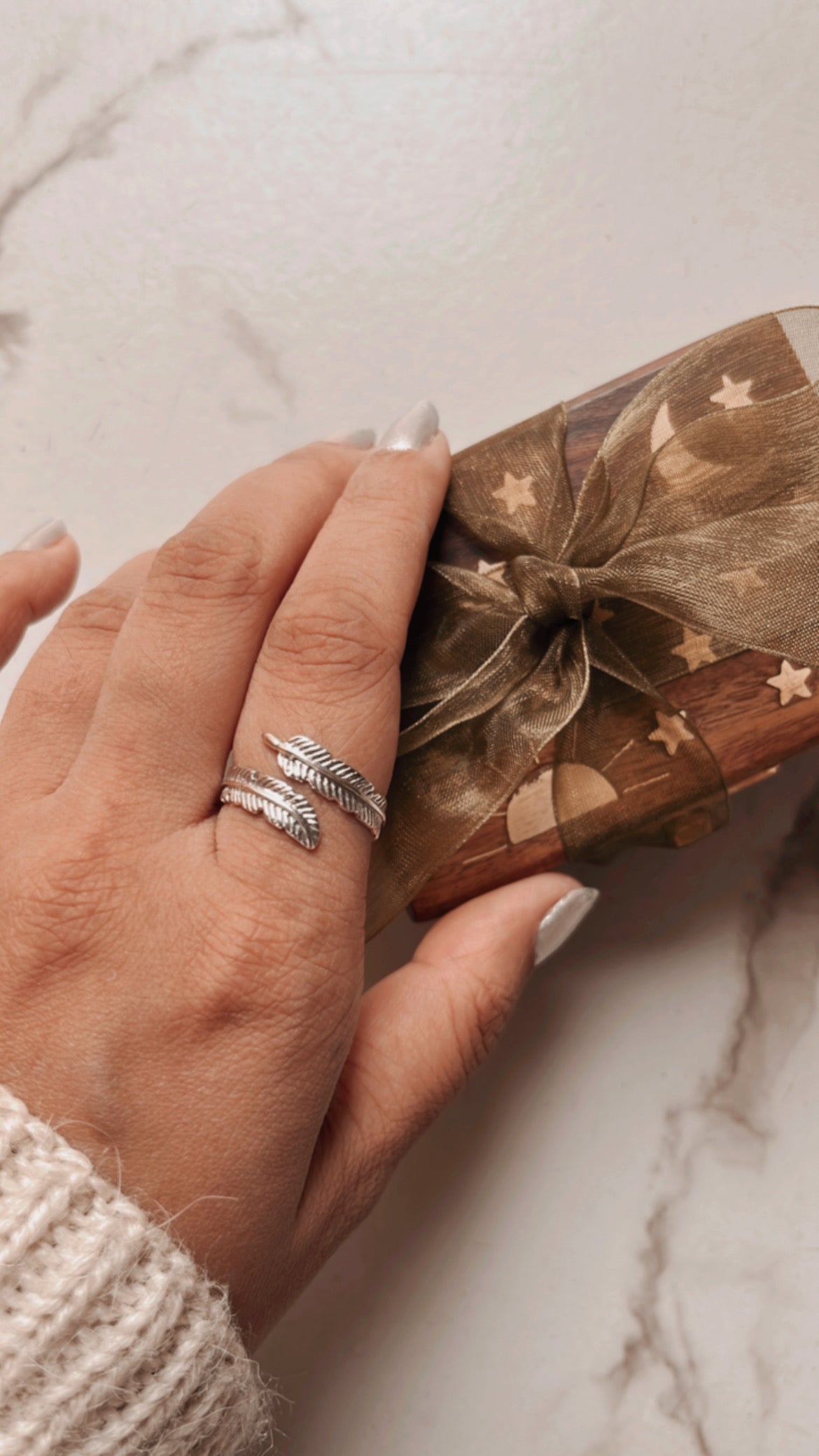 Versatile feather wrap silver ring with an adjustable band for a comfortable fit