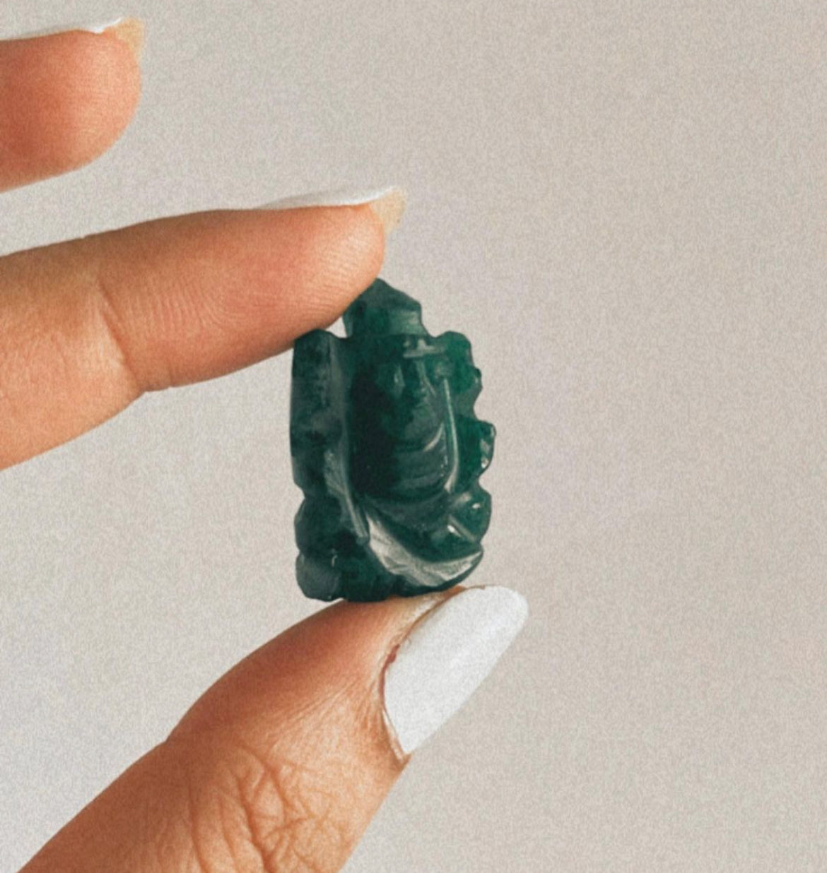 Beautiful hand-carved Ganesh Ji in natural green jade