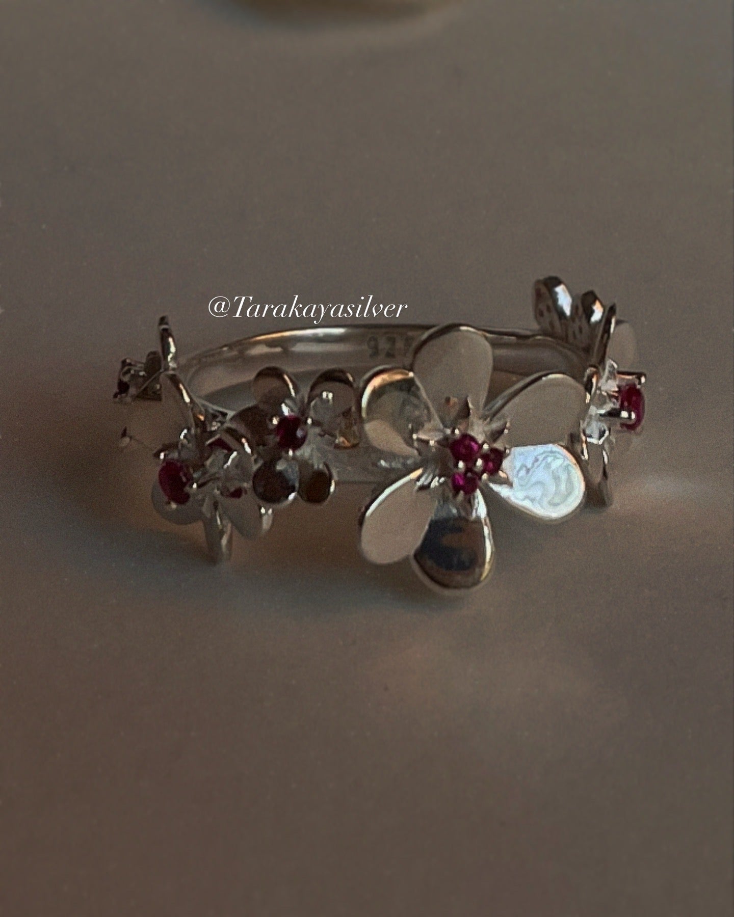 Bold statement ring with ruby lab-grown flowers in sterling silver