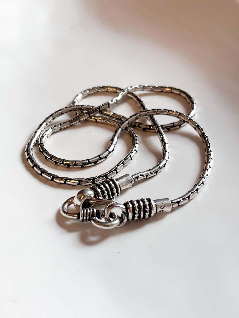Intricate antique design S-lock chain in sterling silver for a sophisticated touch.