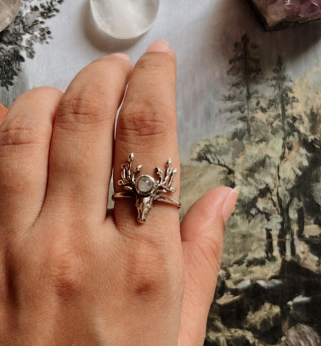 Elegant moonstone silver ring with an antler design.
