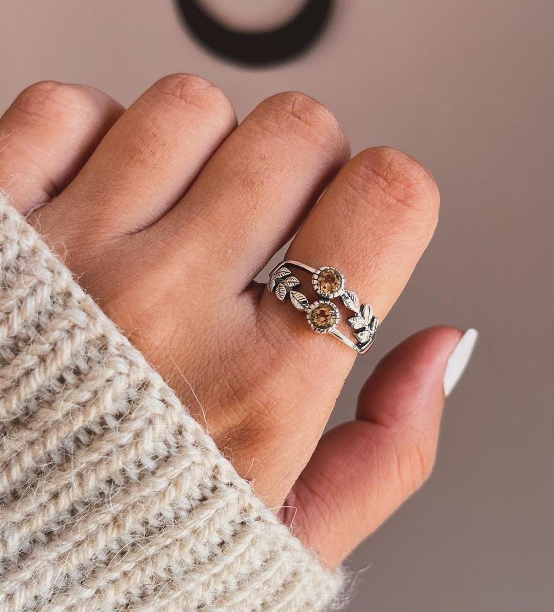 Elegant citrine stone set in a forest-themed silver ring