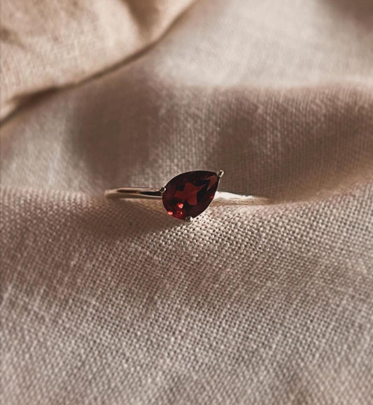 Simple and elegant pear cut garnet solitaire ring in silver