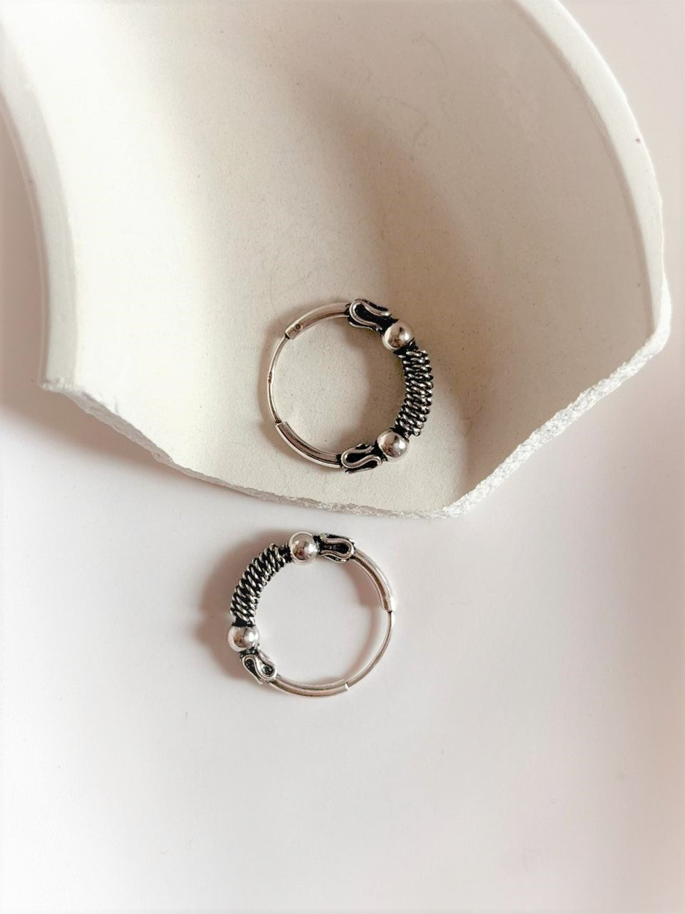 Timeless antique silver hoops with a beautifully detailed design.