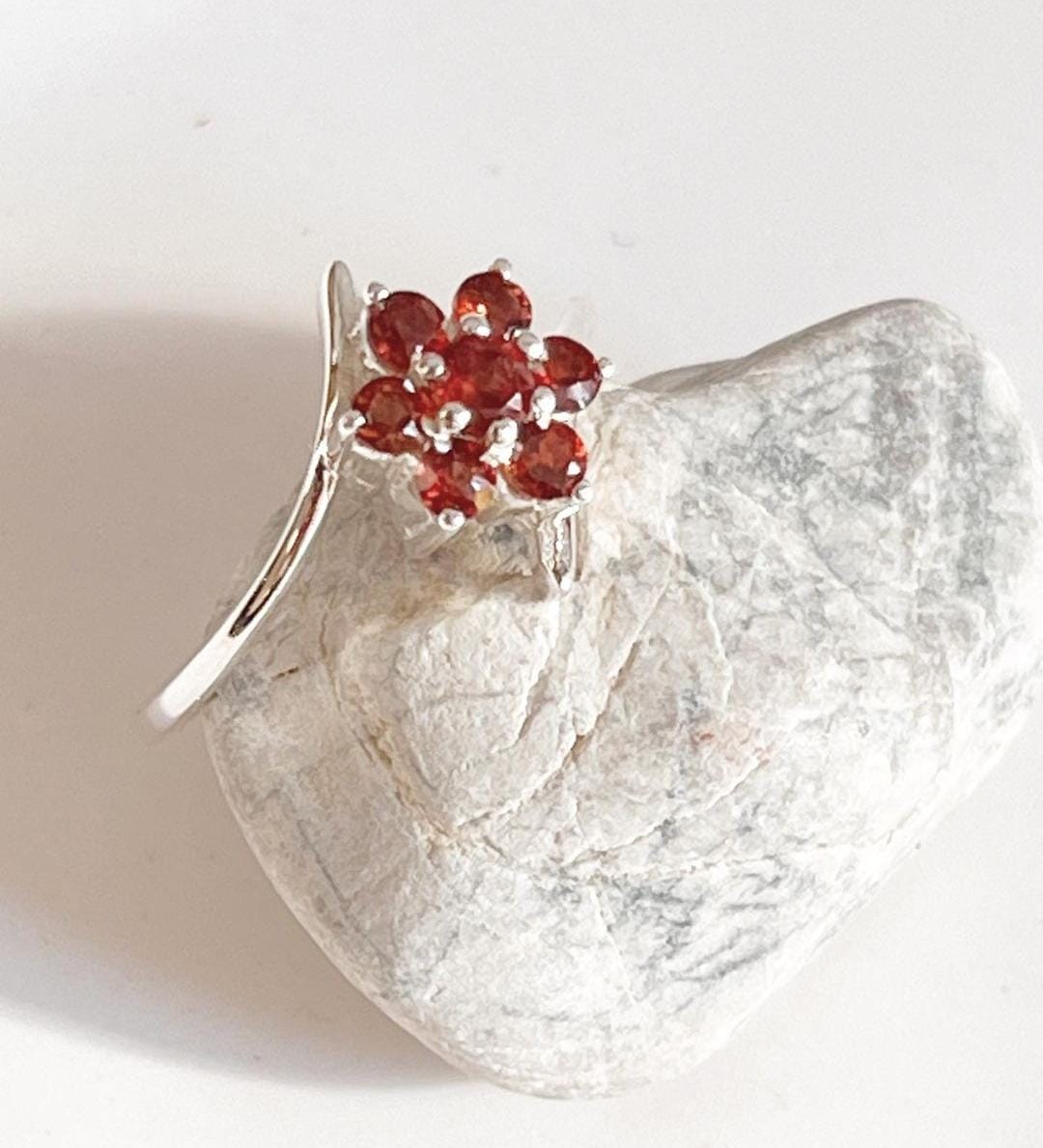 Bold garnet flower statement ring in sterling silver