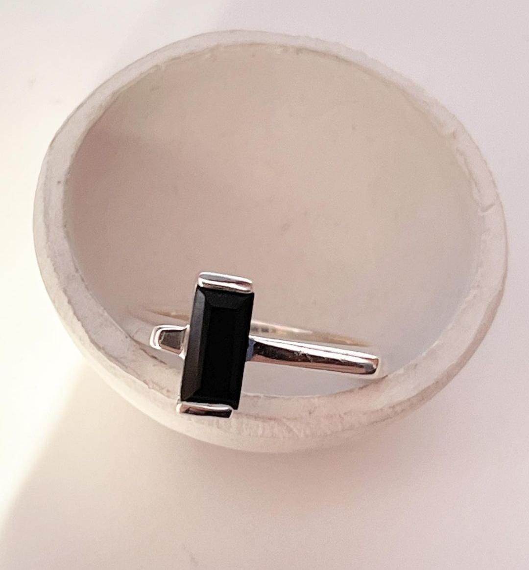 Sophisticated Black Onyx Ring with Side Stones in Silver