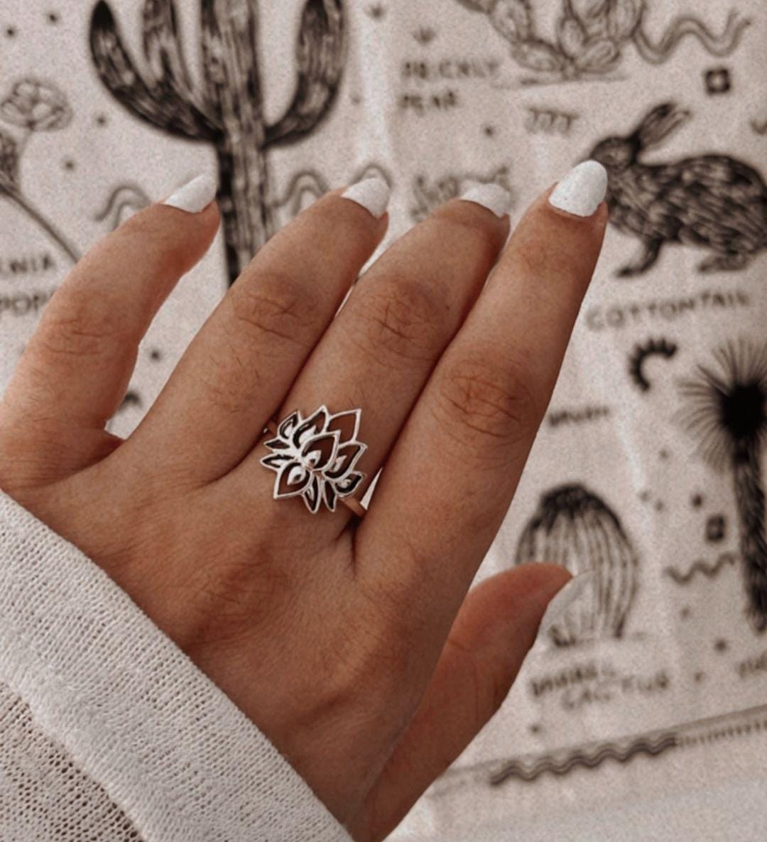 Elegant big lotus ring in sterling silver with detailed petals.