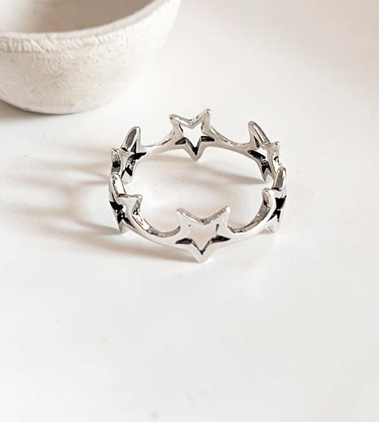Round star band silver ring with celestial design