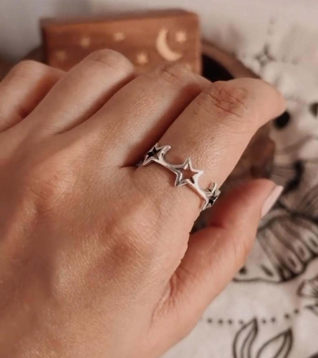 Handcrafted silver ring with round band and star accents