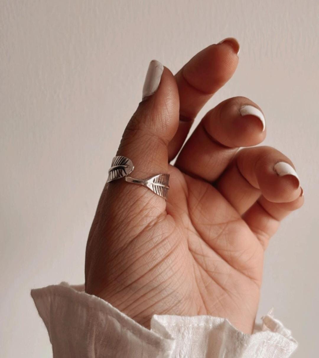 Charming feather wrap adjustable silver ring with a nature-inspired design