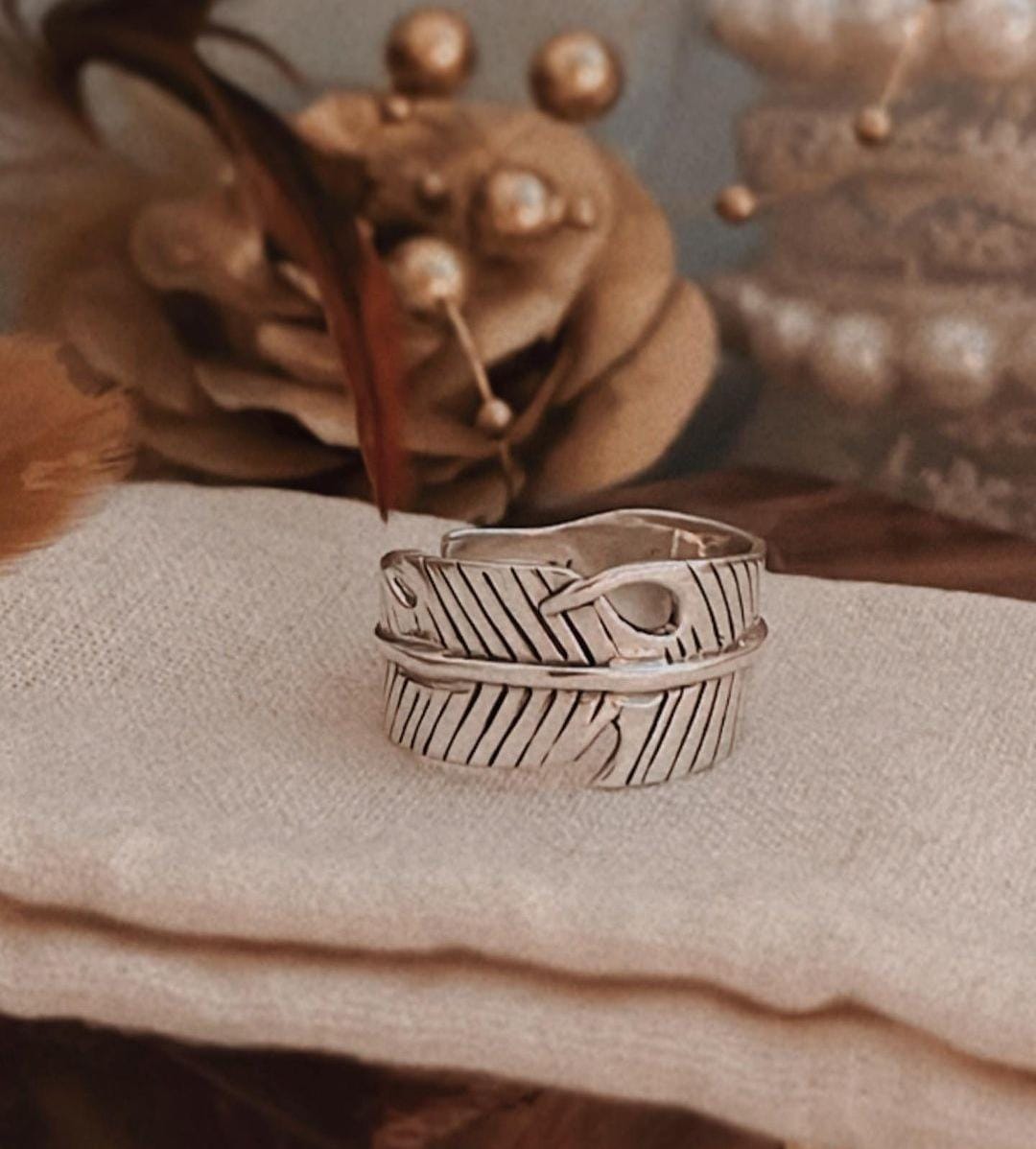 Timeless feather wrap adjustable silver ring featuring delicate feather details