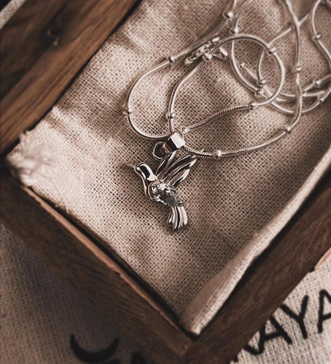 Stylish Blue Topaz Silver Pendant with Dove Charm