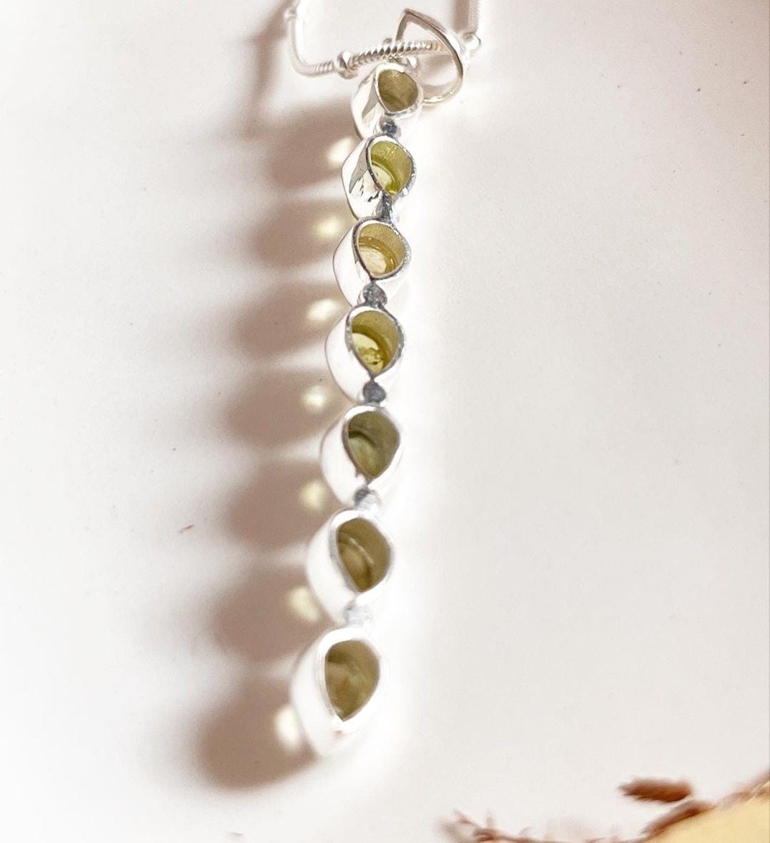 Timeless green tourmaline pear-shaped gemstone pendant in silver