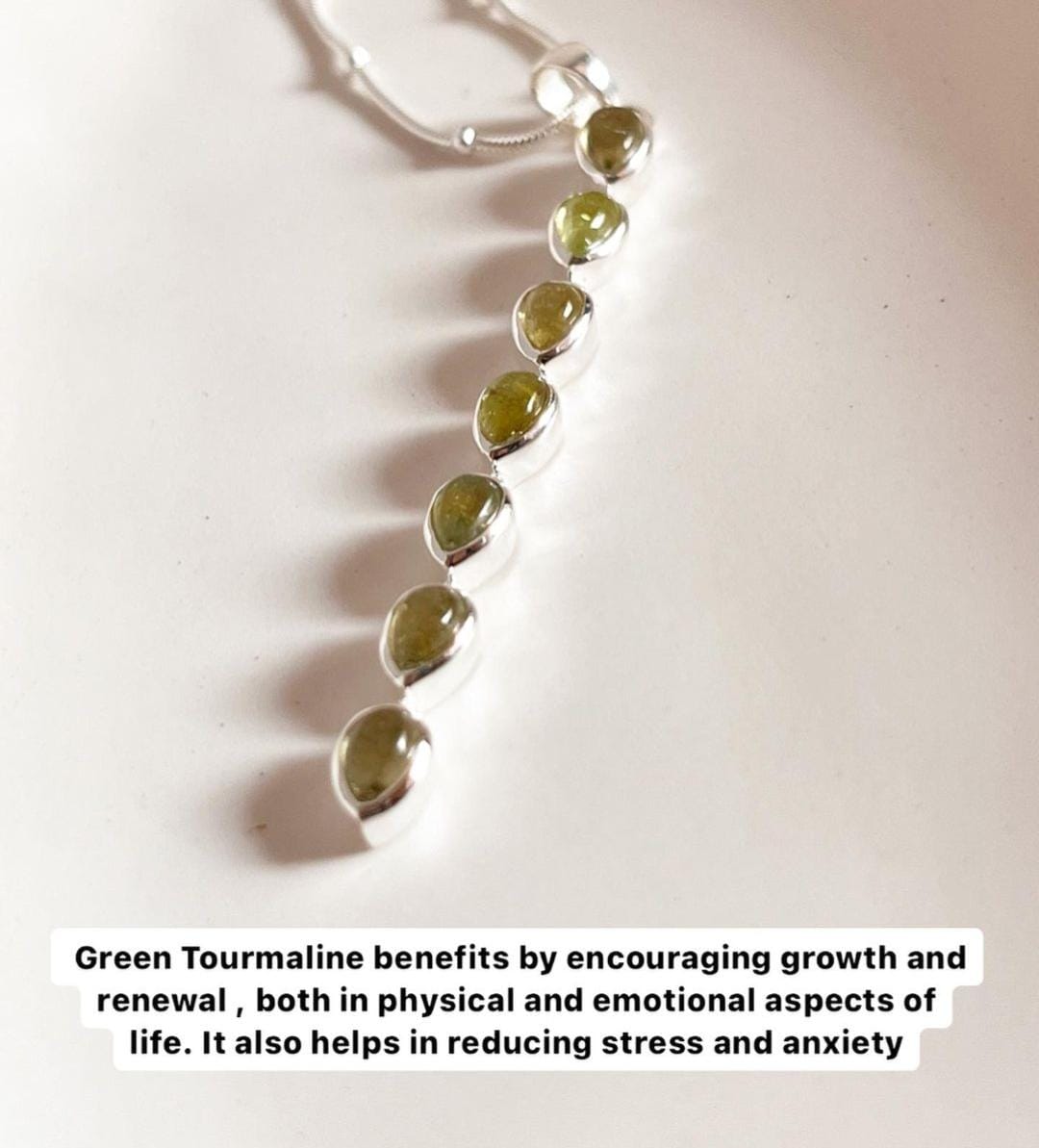 Sterling silver pendant with a green tourmaline pear gemstone