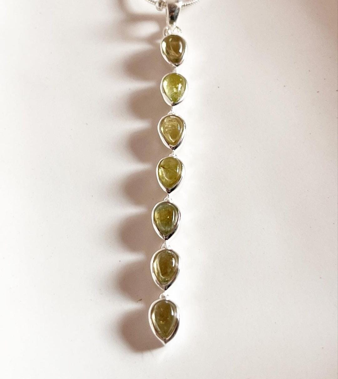 Simple and elegant green tourmaline pear pendant in silver