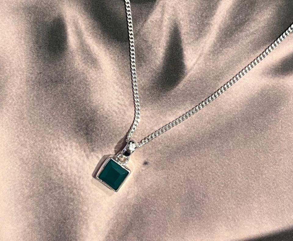 Stylish square cut green onyx pendant with a polished silver setting