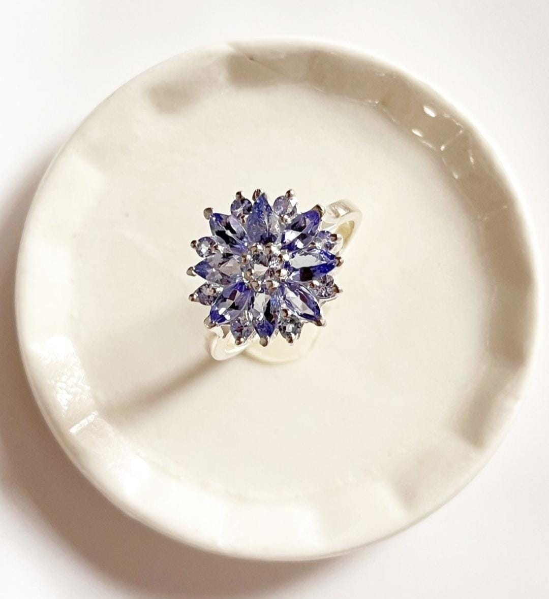 Trendy tanzanite flower ring with bold silver band