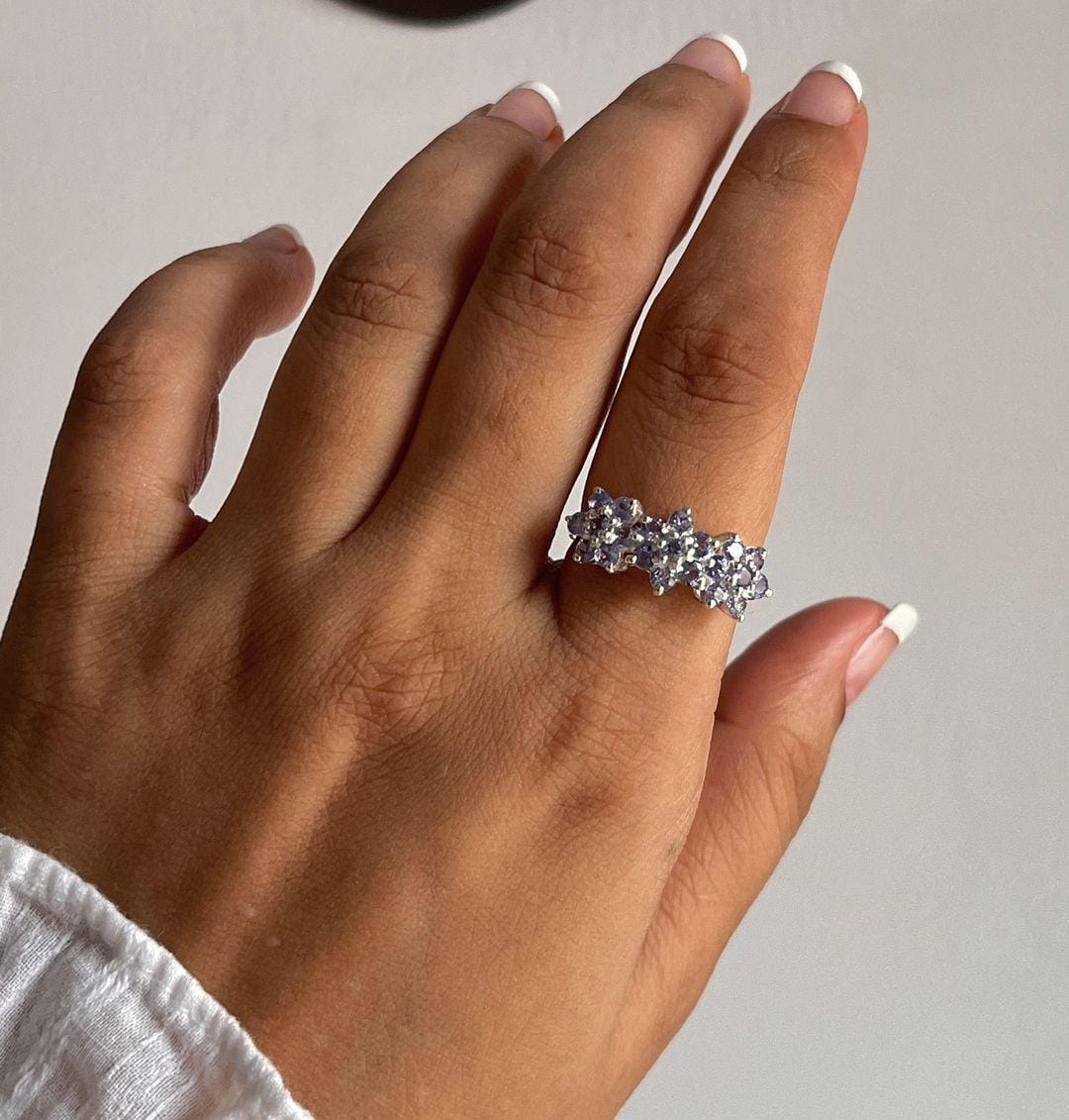 Unique tanzanite flower ring with three blooms in silver