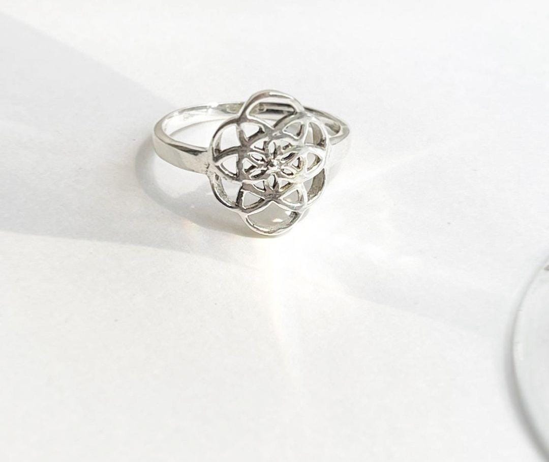 Seed of Life silver ring with intricate sacred geometry design